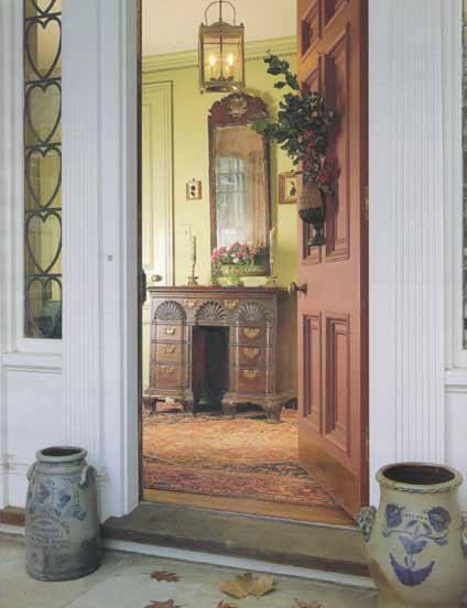 Early American kneehole desk, visible through front door or Meyer home. Photo Credit: From D. Dempsey, Beauty, Country, History: Adolph and Ginger Meyer's Bounty of Excellence (published by Encore Impressions, 2012)